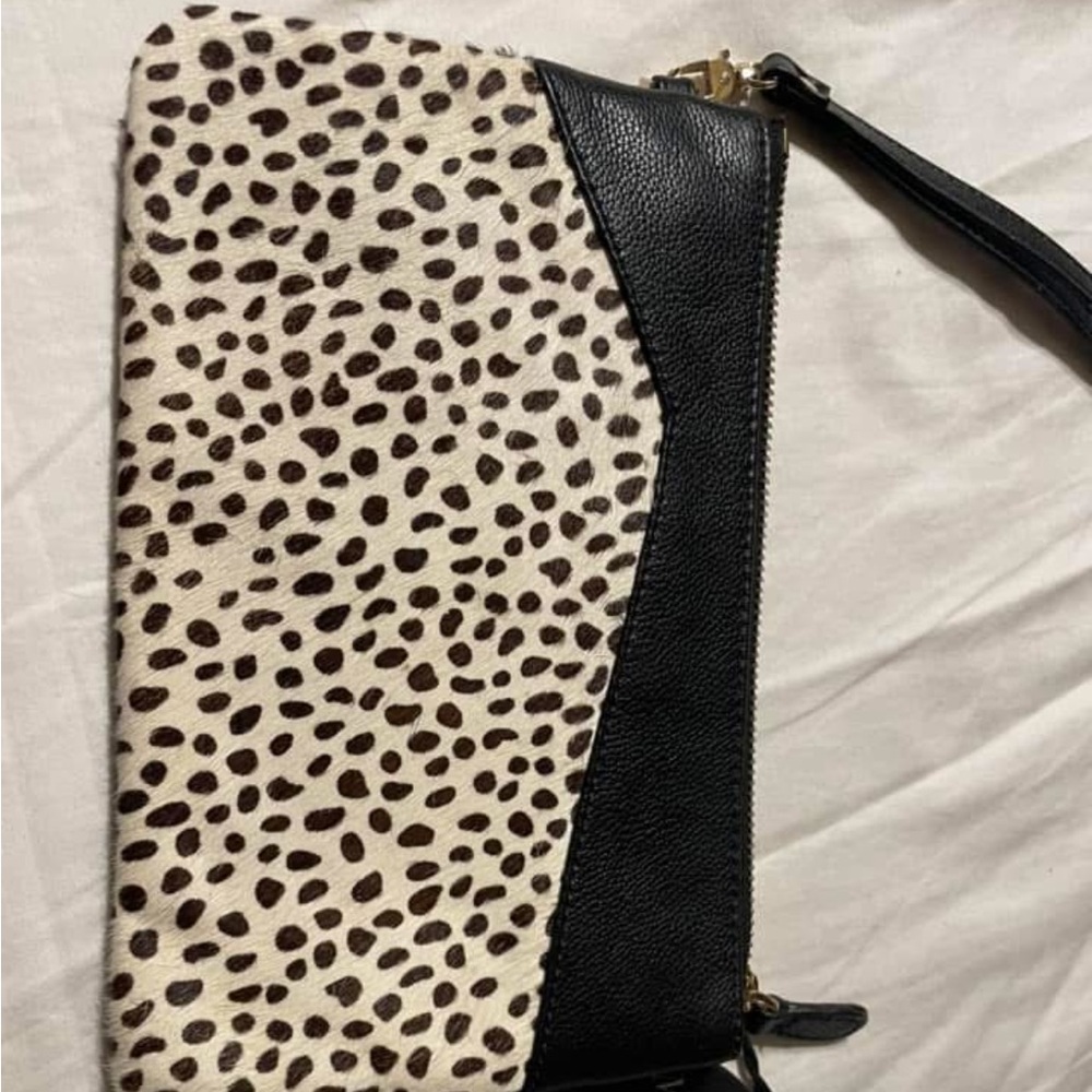 Phone charging wristlet with hair on hide